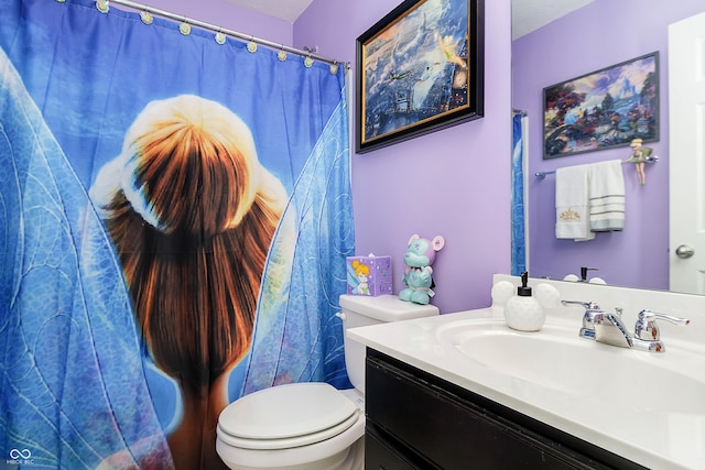 full bathroom featuring vanity and toilet
