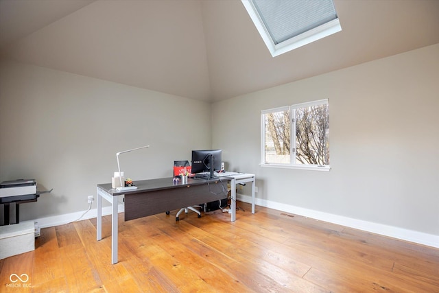 1227 S Pickwick Pt, Bloomington, IN 47401 - office with baseboards, a skylight, and light wood finished floors
