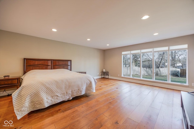1227 S Pickwick Pt, Bloomington, IN 47401 - bedroom with light wood finished floors, baseboards, and recessed lighting