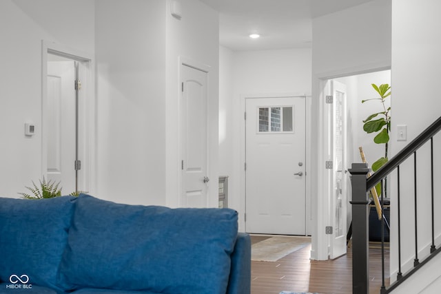 foyer with stairway and wood finished floors