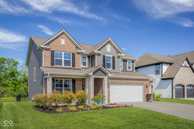 2736 Victory Dr, Columbus, IN 47203 - view of front of home with brick siding, a garage, concrete driveway, and a front yard