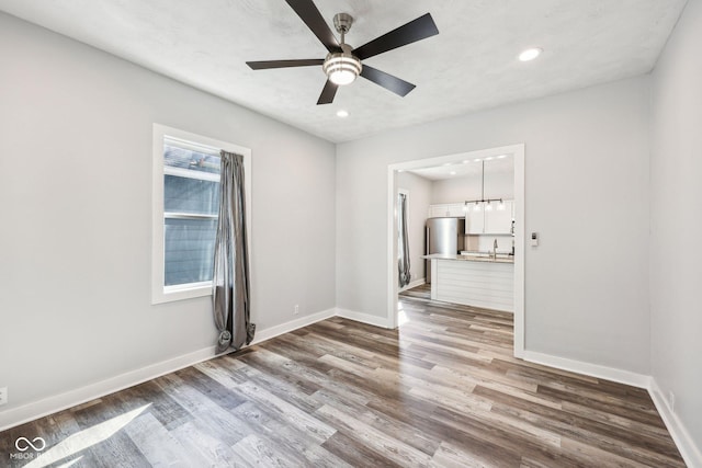 422 N Oxford St, Indianapolis, IN 46201 - unfurnished room featuring wood finished floors, baseboards, ceiling fan, and recessed lighting