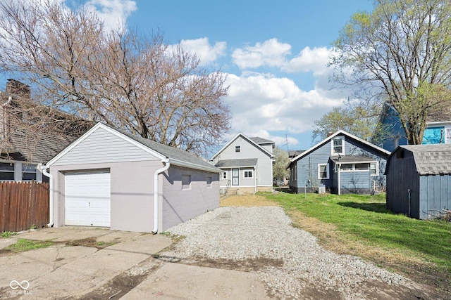 422 N Oxford St, Indianapolis, IN 46201 - detached garage with concrete driveway and a storage shed