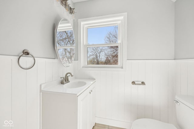 422 N Oxford St, Indianapolis, IN 46201 - bathroom featuring toilet, wainscoting, and vanity