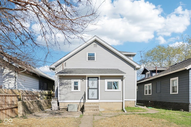 422 N Oxford St, Indianapolis, IN 46201 - rear view of house featuring central AC and roof with shingles