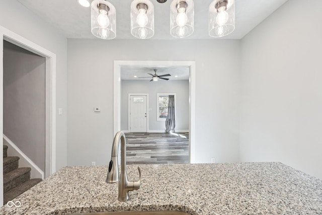 422 N Oxford St, Indianapolis, IN 46201 - kitchen with wood finished floors, a sink, light stone countertops, and a ceiling fan