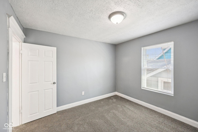 422 N Oxford St, Indianapolis, IN 46201 - carpeted spare room with a textured ceiling and baseboards