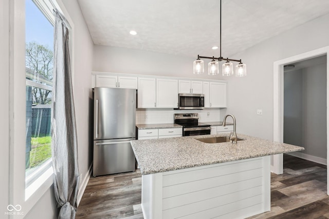 422 N Oxford St, Indianapolis, IN 46201 - kitchen featuring stainless steel appliances, a sink, white cabinets, tasteful backsplash, and light stone countertops