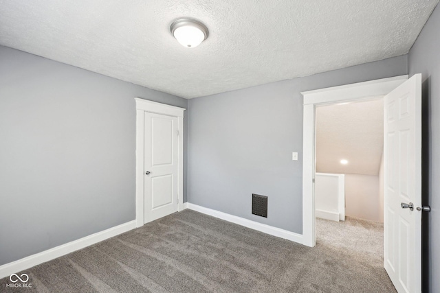422 N Oxford St, Indianapolis, IN 46201 - carpeted empty room with a textured ceiling and baseboards