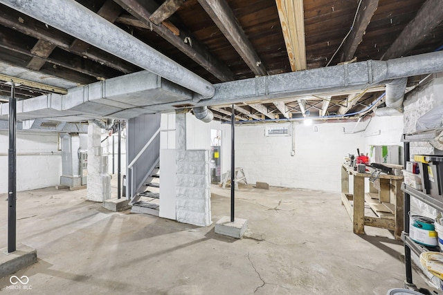 422 N Oxford St, Indianapolis, IN 46201 - unfinished basement featuring stairs and electric water heater