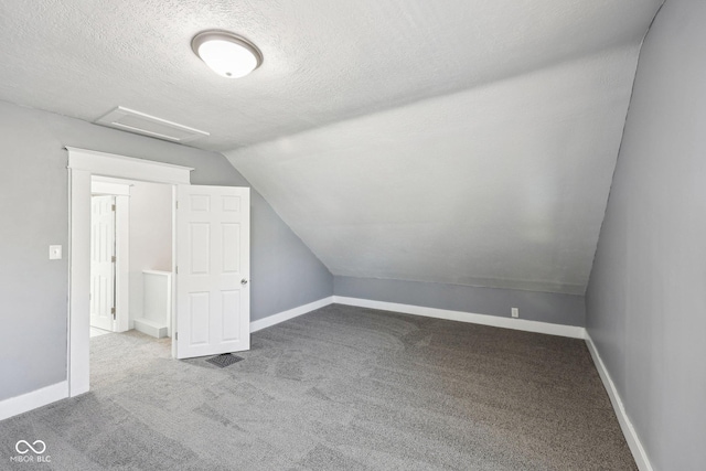 422 N Oxford St, Indianapolis, IN 46201 - bonus room with carpet floors, attic access, vaulted ceiling, baseboards, and a textured ceiling