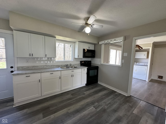 6672 E 225 S, Whitestown, IN 46075 - kitchen with ceiling fan, black appliances, a sink, washer and dryer, and dark wood-style floors