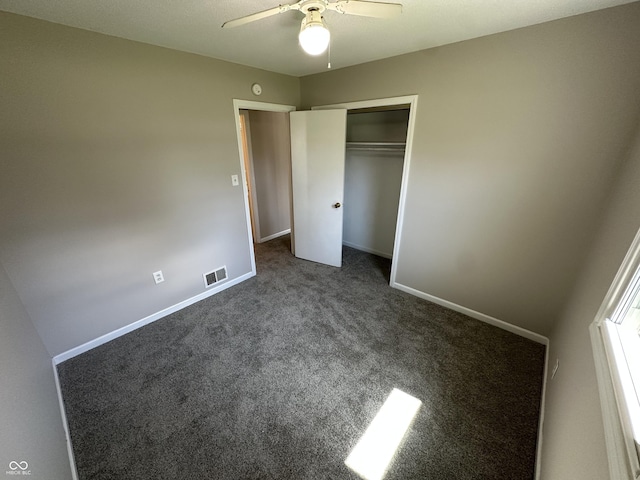 6672 E 225 S, Whitestown, IN 46075 - unfurnished bedroom featuring a closet, dark colored carpet, visible vents, and baseboards