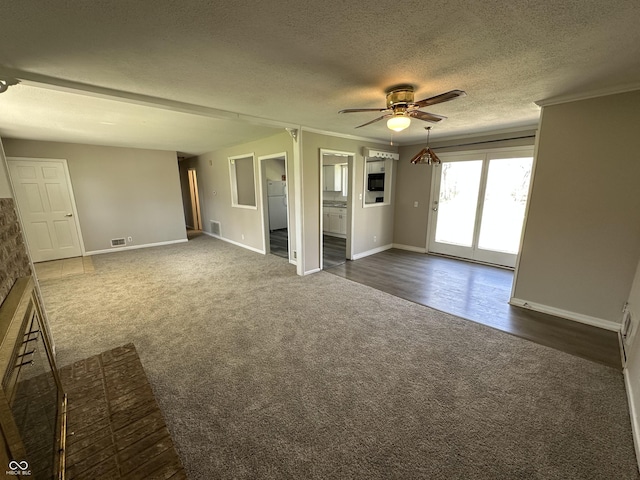 6672 E 225 S, Whitestown, IN 46075 - spare room with ceiling fan, a textured ceiling, ornamental molding, dark colored carpet, and baseboards