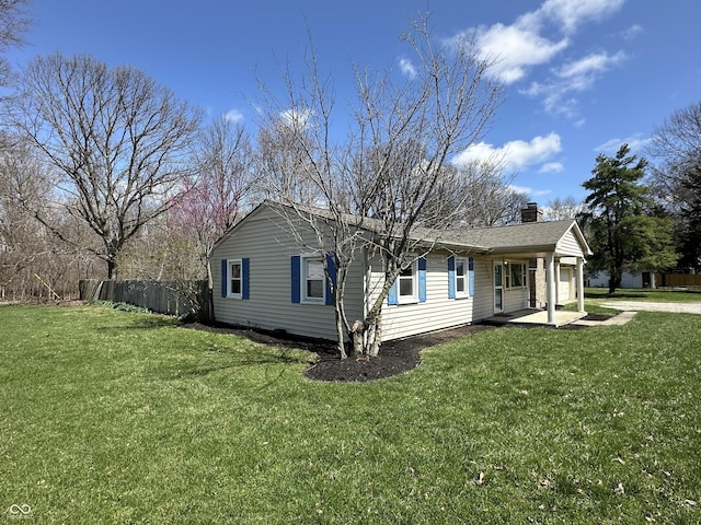 6672 E 225 S, Whitestown, IN 46075 - view of front of house with a front lawn, fence, an attached garage, and a chimney