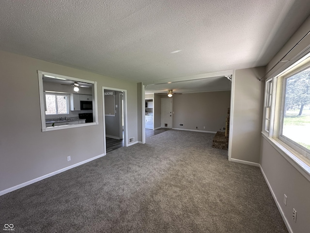 6672 E 225 S, Whitestown, IN 46075 - carpeted empty room with a textured ceiling, ceiling fan, baseboards, and visible vents