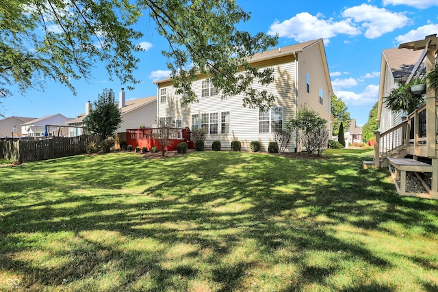 6869 W Winding, Mccordsville, IN 46055 - back of house with a residential view, a wooden deck, fence, and a lawn