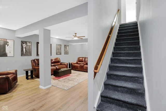 6869 W Winding, Mccordsville, IN 46055 - staircase with baseboards, a ceiling fan, and wood finished floors