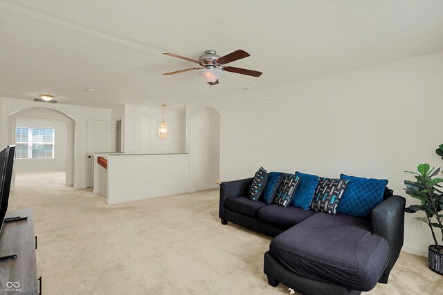 6869 W Winding, Mccordsville, IN 46055 - living room with arched walkways, light colored carpet, and ceiling fan