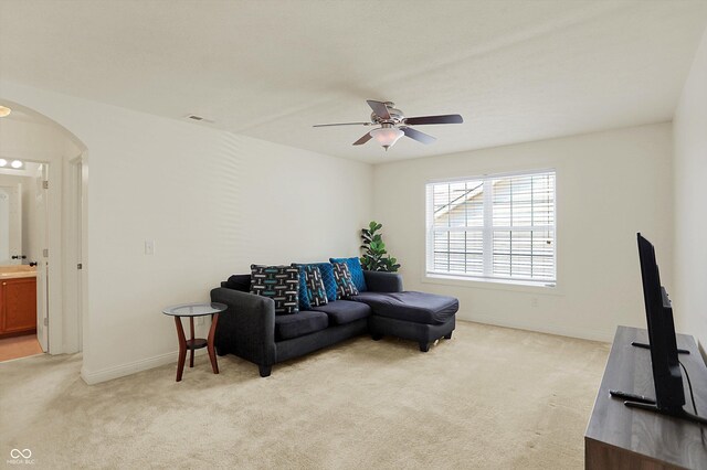6869 W Winding, Mccordsville, IN 46055 - living room with visible vents, baseboards, arched walkways, ceiling fan, and light colored carpet
