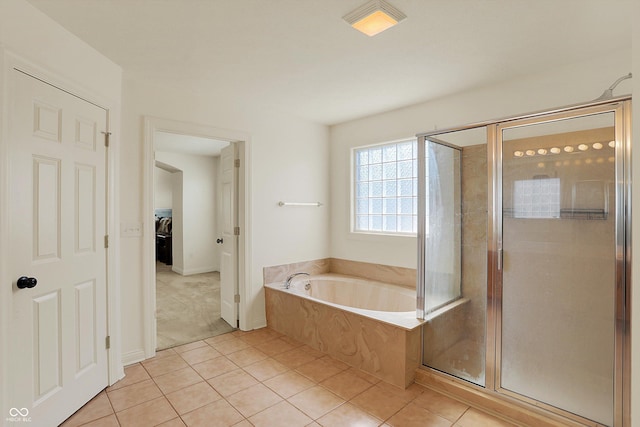 6869 W Winding, Mccordsville, IN 46055 - bathroom featuring tile patterned floors, baseboards, a garden tub, and a stall shower