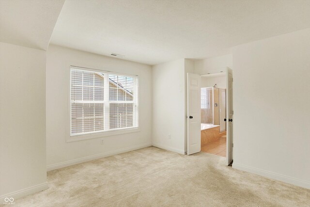 6869 W Winding, Mccordsville, IN 46055 - spare room featuring light colored carpet, baseboards, and visible vents