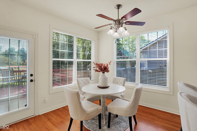 6869 W Winding, Mccordsville, IN 46055 - dining space with baseboards, ceiling fan, and light wood-style floors