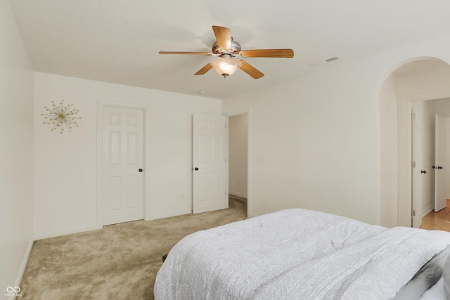 6869 W Winding, Mccordsville, IN 46055 - bedroom featuring arched walkways, visible vents, baseboards, and light colored carpet