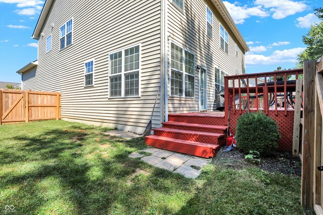 6869 W Winding, Mccordsville, IN 46055 - view of side of home with a yard, a wooden deck, and fence