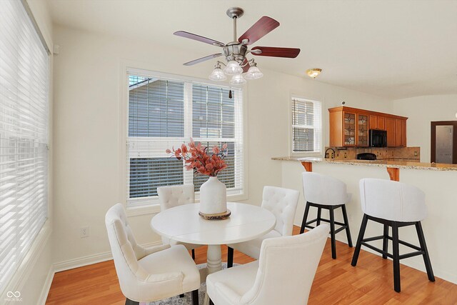 6869 W Winding, Mccordsville, IN 46055 - dining room with light wood-style floors, baseboards, and a ceiling fan