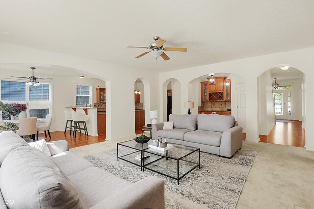 6869 W Winding, Mccordsville, IN 46055 - living area featuring arched walkways and a ceiling fan