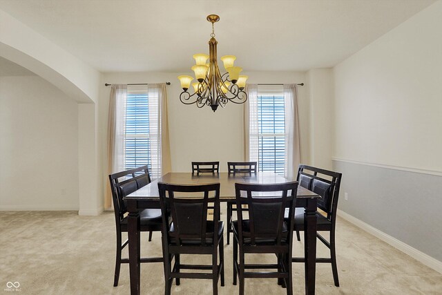 6869 W Winding, Mccordsville, IN 46055 - dining room with plenty of natural light, an inviting chandelier, and light carpet