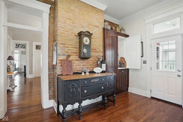 entrance foyer featuring dark wood-style flooring, baseboards, and ornamental molding