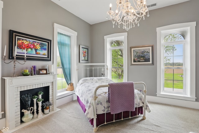 bedroom featuring a chandelier, visible vents, and carpet