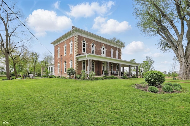 italianate home with covered porch, a front lawn, and brick siding