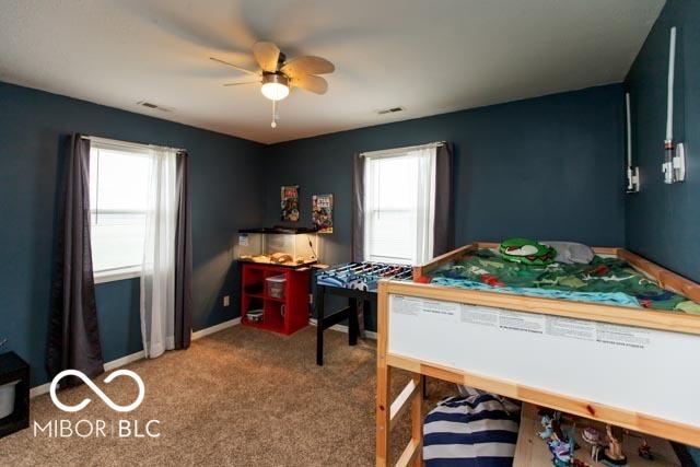 5973 Masten Rd, Coatesville, IN 46121 - bedroom featuring carpet floors, baseboards, ceiling fan, and visible vents