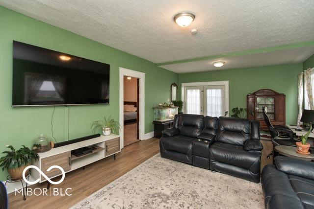 5973 Masten Rd, Coatesville, IN 46121 - living area featuring a textured ceiling and wood finished floors