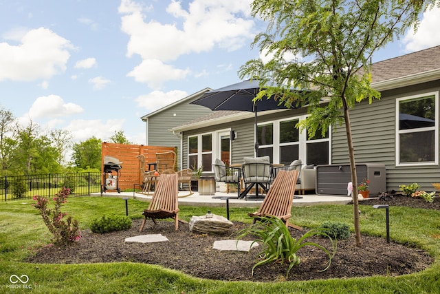1024 Cyprian Way, Lebanon, IN 46052 - back of property with a patio and roof with shingles