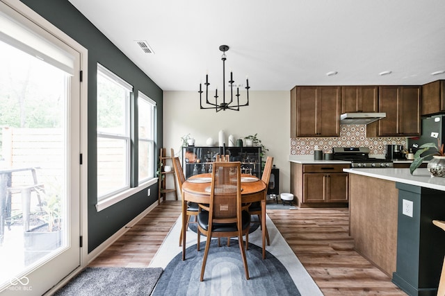 1024 Cyprian Way, Lebanon, IN 46052 - dining room with a chandelier and wood finished floors