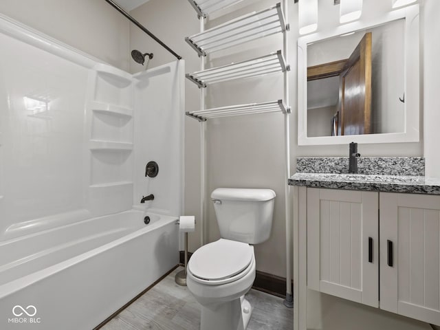 270 W Broadway St, Shelbyville, IN 46176 - full bathroom with toilet, vanity,  shower combination, wood finished floors, and baseboards