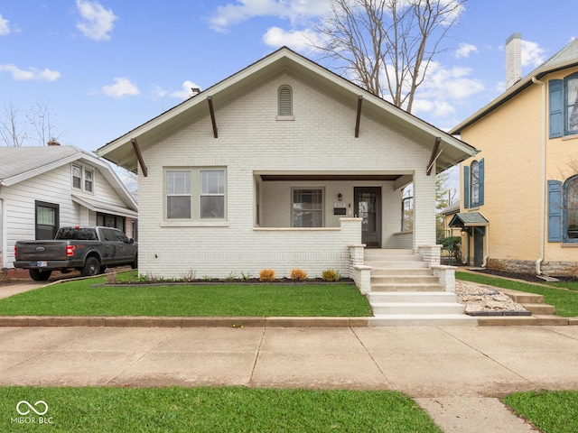 270 W Broadway St, Shelbyville, IN 46176 - bungalow-style house with brick siding and a front yard