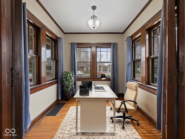 270 W Broadway St, Shelbyville, IN 46176 - home office with baseboards, light wood-style flooring, ornamental molding, and visible vents