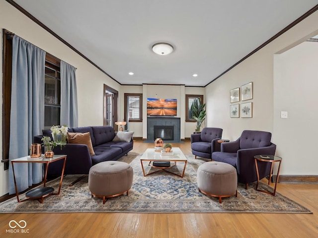 270 W Broadway St, Shelbyville, IN 46176 - living area featuring baseboards, a fireplace, wood finished floors, and ornamental molding