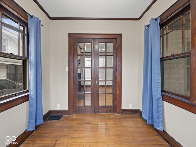 270 W Broadway St, Shelbyville, IN 46176 - interior space featuring baseboards, crown molding, wood finished floors, and french doors