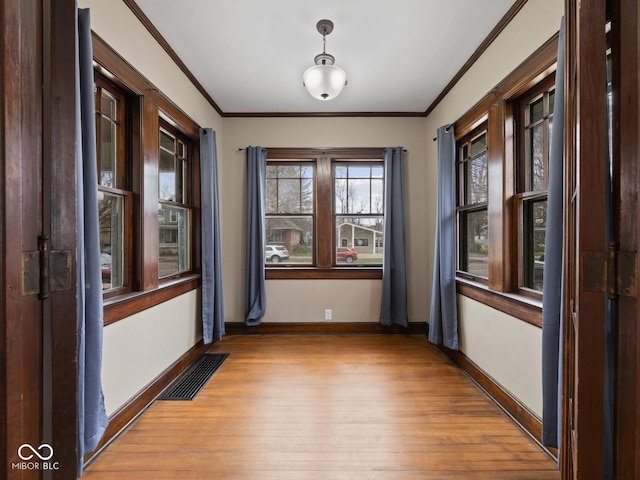 270 W Broadway St, Shelbyville, IN 46176 - spare room featuring visible vents, light wood-style floors, and crown molding