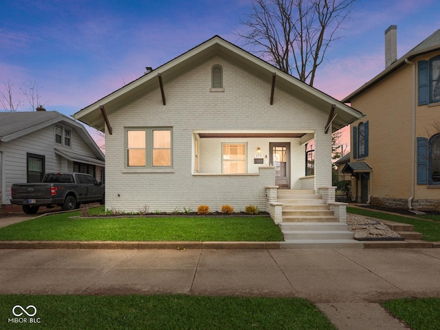 270 W Broadway St, Shelbyville, IN 46176 - bungalow-style house featuring brick siding and a front yard