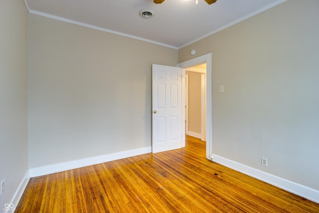3619 Salem St, Indianapolis, IN 46208 - empty room featuring wood finished floors, ornamental molding, baseboards, and visible vents