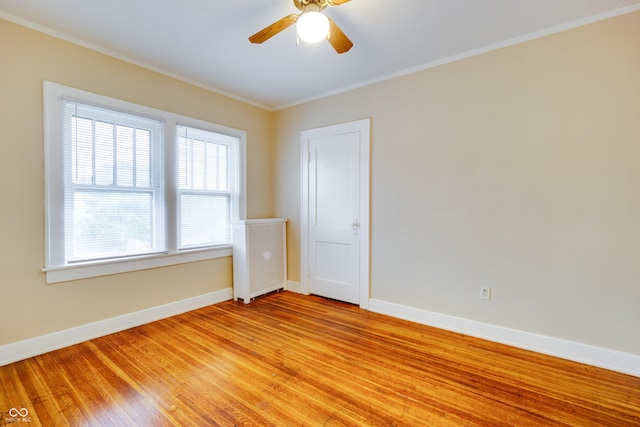 3619 Salem St, Indianapolis, IN 46208 - unfurnished room with baseboards, crown molding, light wood-style floors, and a ceiling fan
