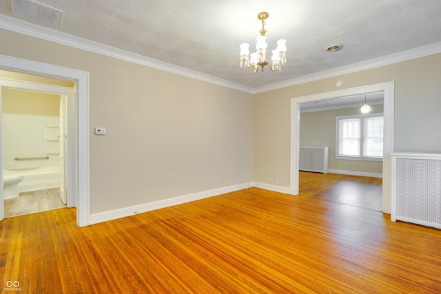 3619 Salem St, Indianapolis, IN 46208 - spare room with crown molding, light wood finished floors, radiator heating unit, visible vents, and an inviting chandelier