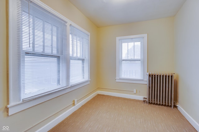 3619 Salem St, Indianapolis, IN 46208 - empty room featuring a wealth of natural light, radiator heating unit, and baseboards